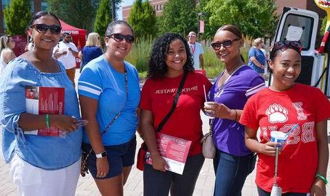 Parents and students posing at the block party